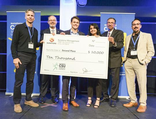 ECE Student Sokiyna Naser, 3rd from the Right, Along with Conor Seal, 4th from the Right, Receive Their Award